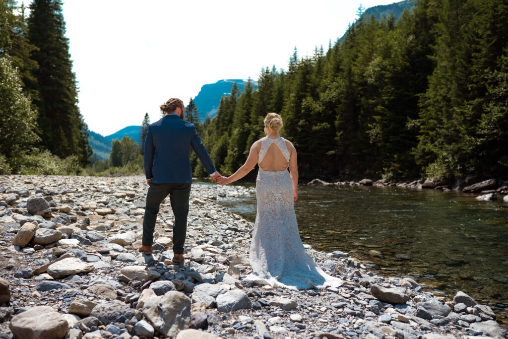 Elopement couple in the river bed in glacier national park