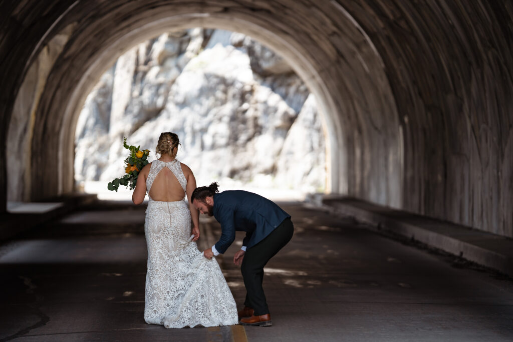 couple in glacier national park tunnel