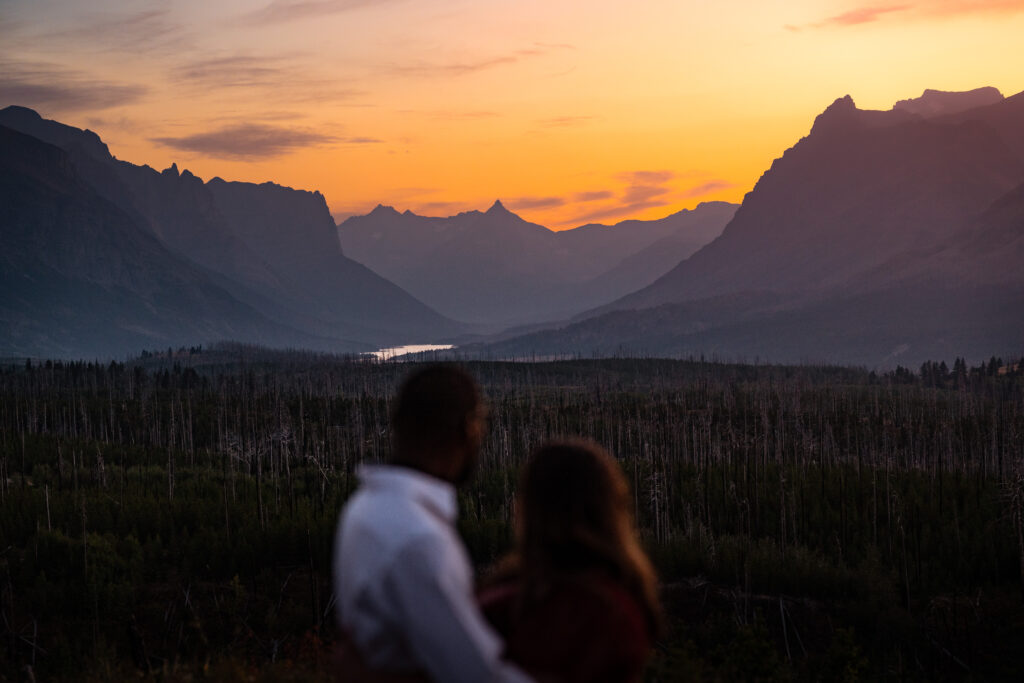 Couple admiring the beautiful sunset.