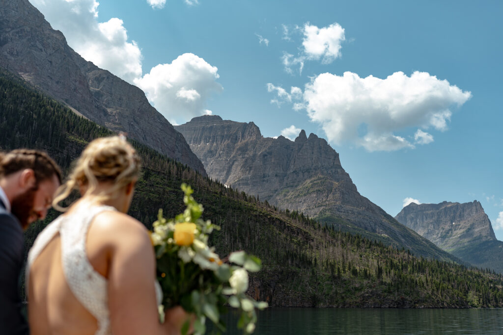 Bride and groom with mountains overhead