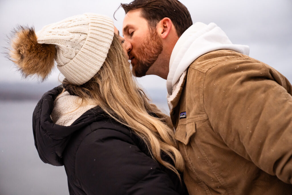 engages couple kissing in the snow