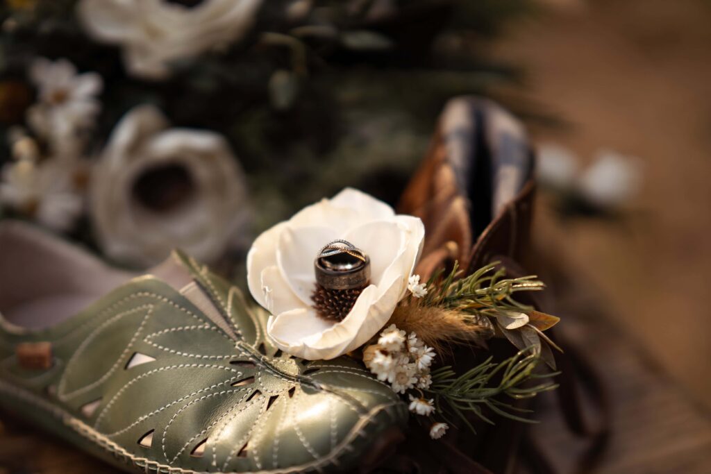 Wedding details, rings, and flowers.