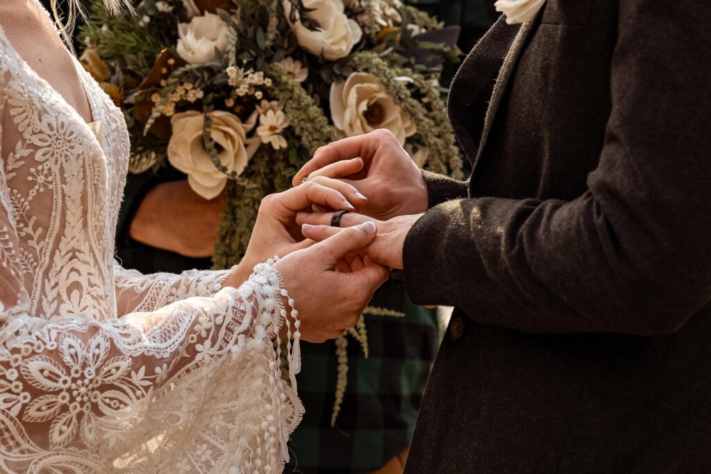 Couple exchanging rings during an elopement.