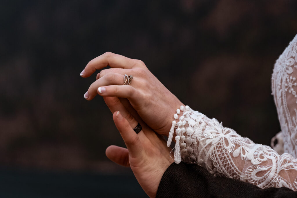 Bride and groom holding hands.