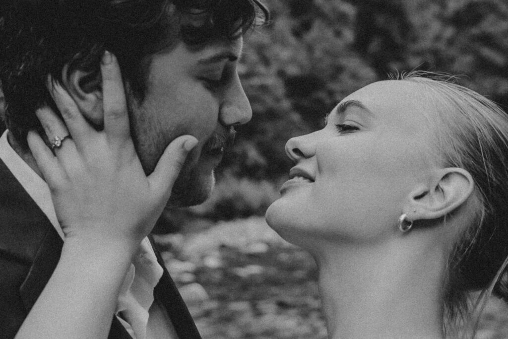 Bride and groom kissing. Black and white.