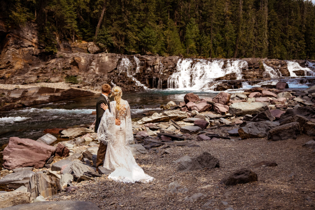 Couple eloping in a unique location near a waterfall.